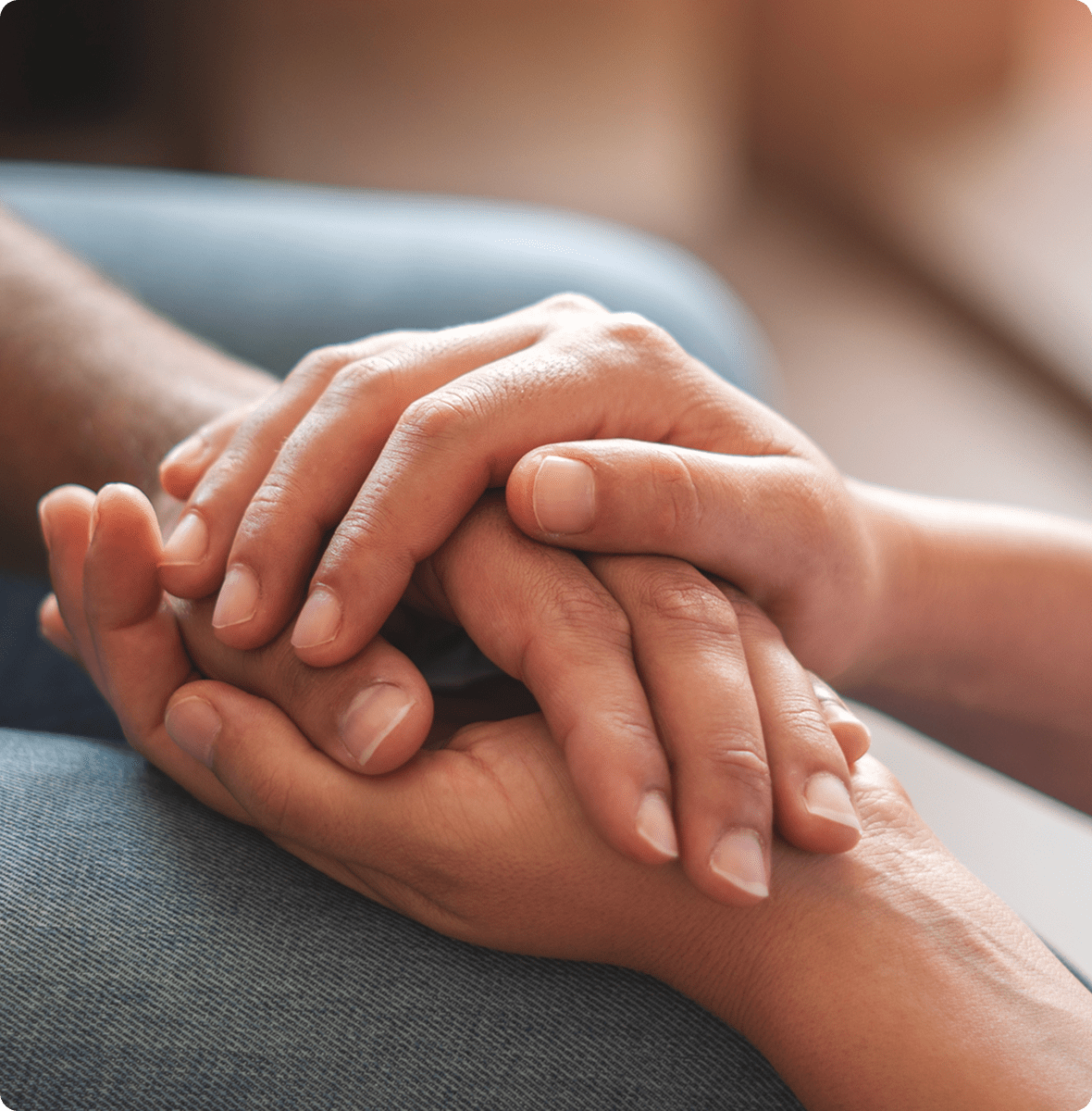 Close-up of comforting handhold