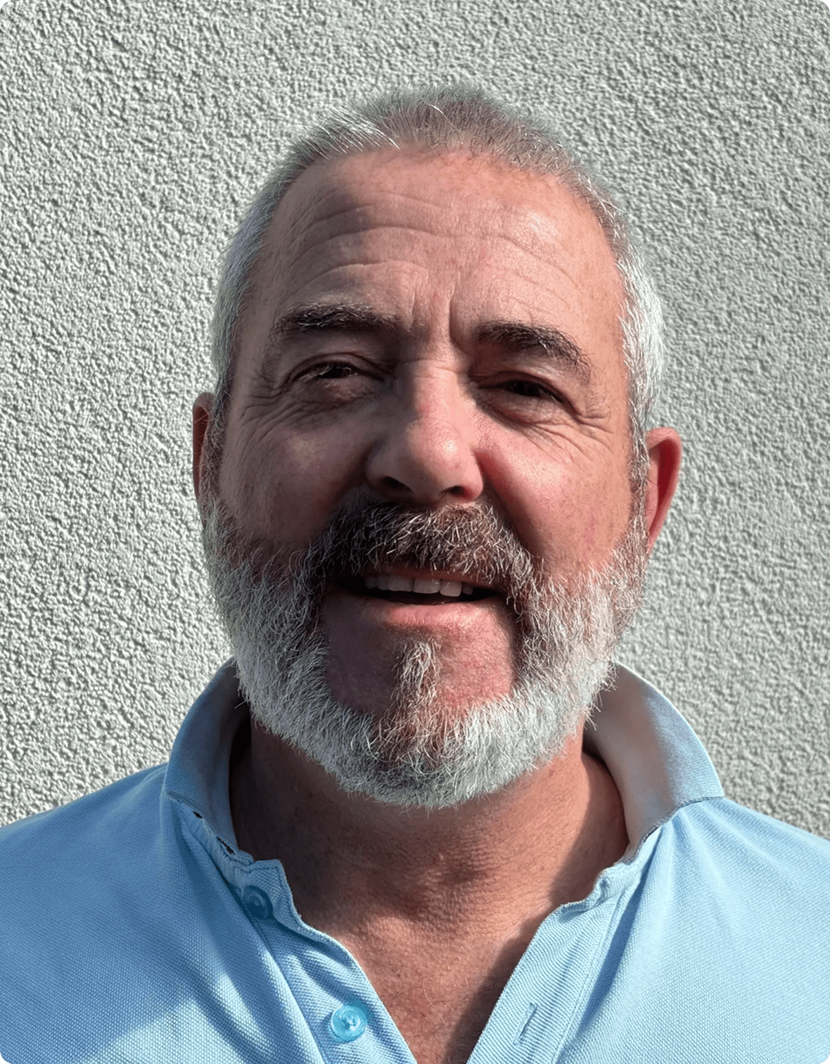 Older man in a light blue shirt